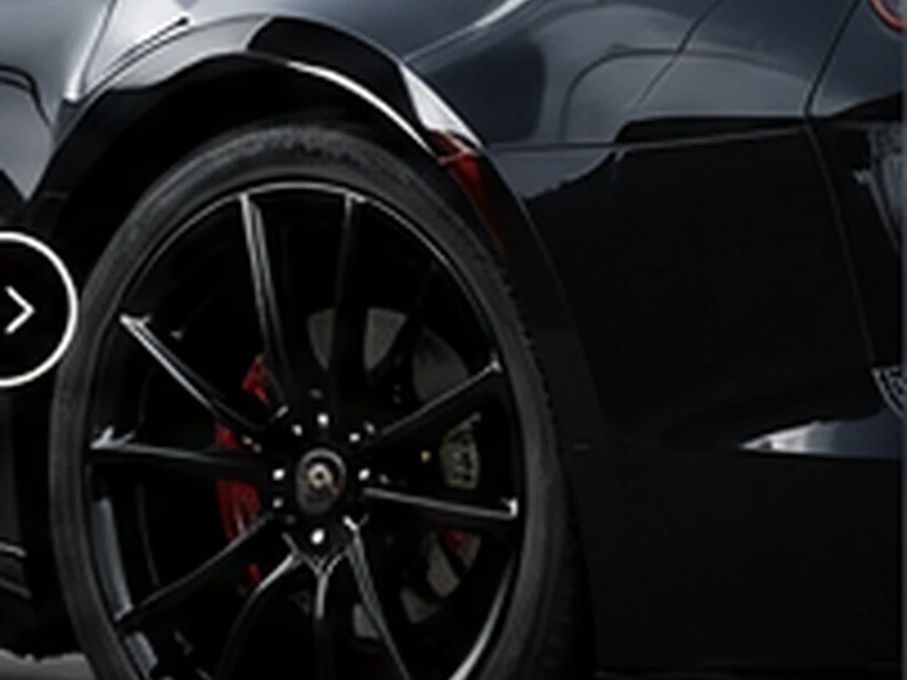 Flawless glossy black panel and wheel after a full detail